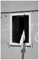 Laundry hanging from a window, Burano. Venice, Veneto, Italy (black and white)