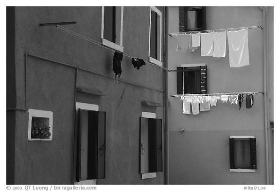 Multicolored houses and hanging laundry, Burano. Venice, Veneto, Italy (black and white)