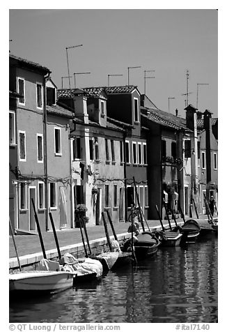 Canal lined with brightly painted houses, Burano. Venice, Veneto, Italy (black and white)