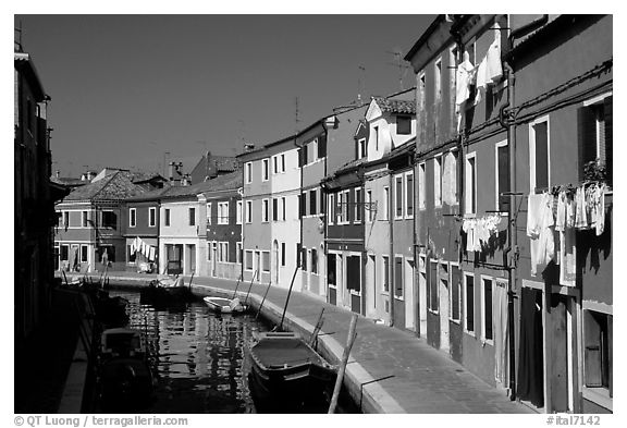 Canal lined with multihued houses, Burano. Venice, Veneto, Italy (black and white)