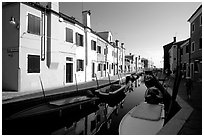 Colorful painted houses along canal, Burano. Venice, Veneto, Italy (black and white)