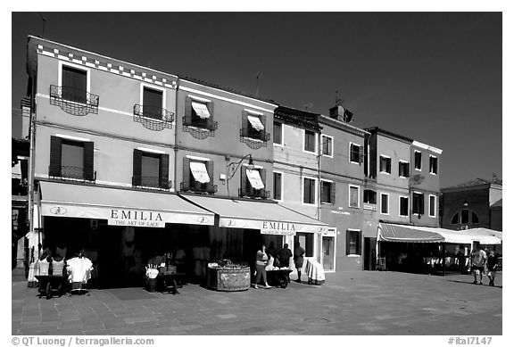 Street with brightly painted houses, Burano. Venice, Veneto, Italy (black and white)