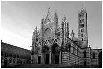 Siena Cathedral (Duomo) with bands of colored marble, late afternoon. Siena, Tuscany, Italy ( black and white)