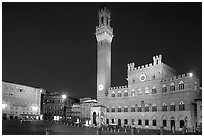 Piazza Del Campo and Palazzo Pubblico at night. Siena, Tuscany, Italy (black and white)