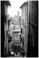 Narrow street with church in background. Siena, Tuscany, Italy ( black and white)