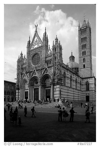Richly decorated cathedral facade, afternoon. Siena, Tuscany, Italy