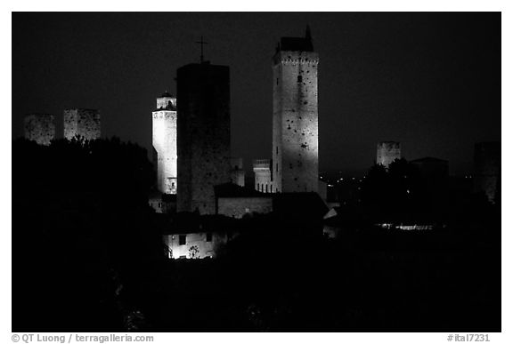 Medieval towers seen from the Rocca at night. San Gimignano, Tuscany, Italy (black and white)