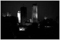 Medieval towers seen from the Rocca at night. San Gimignano, Tuscany, Italy (black and white)