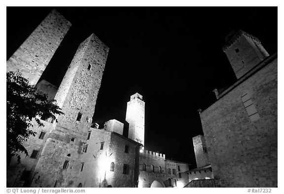 Medieval towers above Piazza del Duomo at night. San Gimignano, Tuscany, Italy (black and white)