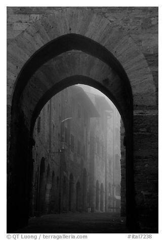 Arch at dawn in the fog. San Gimignano, Tuscany, Italy (black and white)