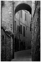 Arch and narrow street. San Gimignano, Tuscany, Italy (black and white)