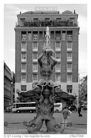 Tritone Fountain and hotel Bernini. Rome, Lazio, Italy (black and white)