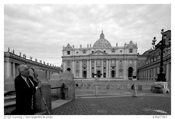 Pilgrim prays in front of the Basilic Saint Peter. Vatican City