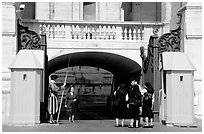 Nuns move past checkpoint manned by Swiss guards. Vatican City (black and white)