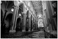 Church interior looking down the nave to the apse. Naples, Campania, Italy ( black and white)