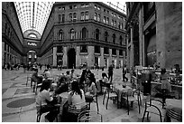 Women enjoy gelato inside the Galleria Umberto I. Naples, Campania, Italy ( black and white)