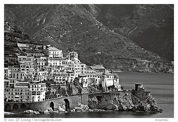 Houses built on a rocky promontory in Amalfi. Amalfi Coast, Campania, Italy