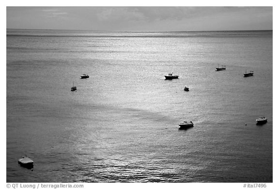 Small boats at sunset in the Gulf of Salerno, Positano. Amalfi Coast, Campania, Italy