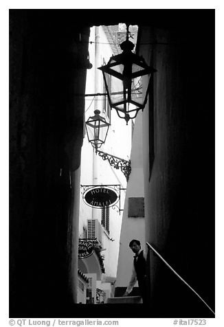 Narrow stairway with formally dressed man and hotel sign,  Amalfi. Amalfi Coast, Campania, Italy (black and white)