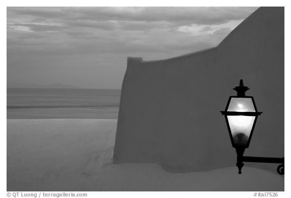 Lamp, White walls, pastel colors of sunset, Positano. Amalfi Coast, Campania, Italy (black and white)