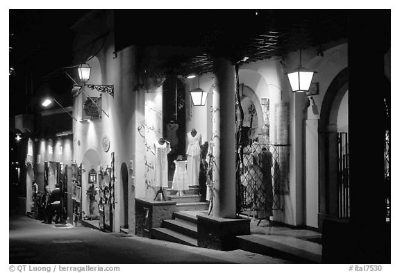 Expensive stores at night on Via Pasitea. Amalfi Coast, Campania, Italy (black and white)