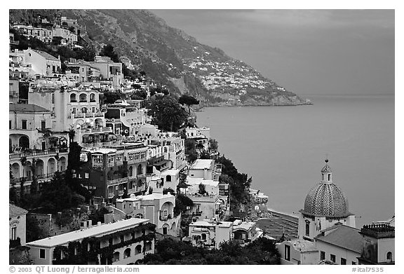 Chiesa di Santa Maria Assunta and houses on steep hills at dusk, Positano. Amalfi Coast, Campania, Italy