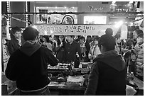 Street food by night. Seoul, South Korea ( black and white)