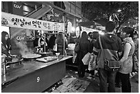 People lining up for street food. Seoul, South Korea (black and white)