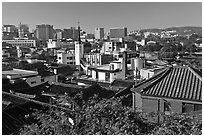 Hanok houses overlooking modern skyline. Seoul, South Korea ( black and white)