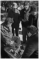 Elderly men play game of baduk (go). Seoul, South Korea ( black and white)