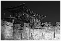 Wall and Janganmun gate at night, Suwon Hwaseong Fortress. South Korea (black and white)