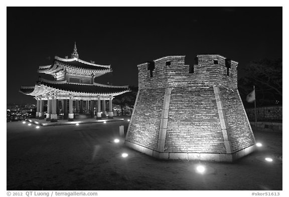 Crossbow tower and command post at night,  city lights, Suwon. South Korea (black and white)