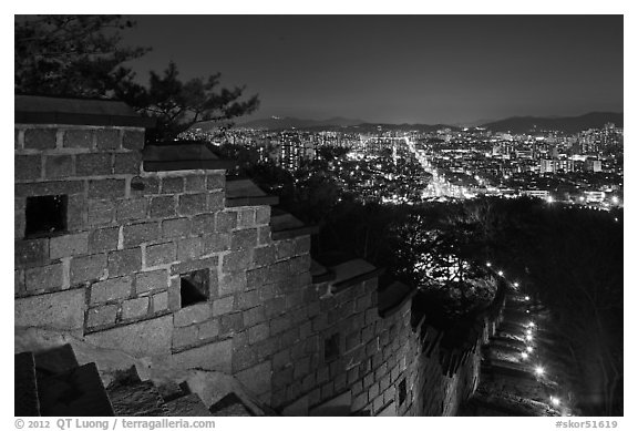 Rampart wall and city lights, Suwon Hwaseong Fortress. South Korea (black and white)