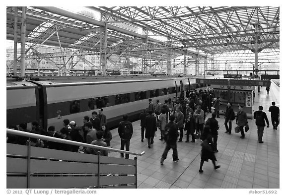 Passengers boarding high speed KTX train. Seoul, South Korea (black and white)