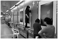 Photography exhibit being installed in subway. Daegu, South Korea (black and white)