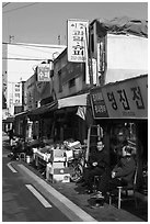 Shopkeepers and storefronts. Daegu, South Korea (black and white)