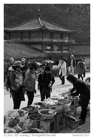 Hikers buy natural products near Haeinsa. South Korea (black and white)