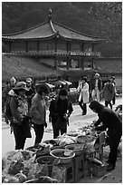 Hikers buy natural products near Haeinsa. South Korea ( black and white)