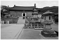 Three-story stone pagoda and main hall, Haeinsa Temple. South Korea ( black and white)