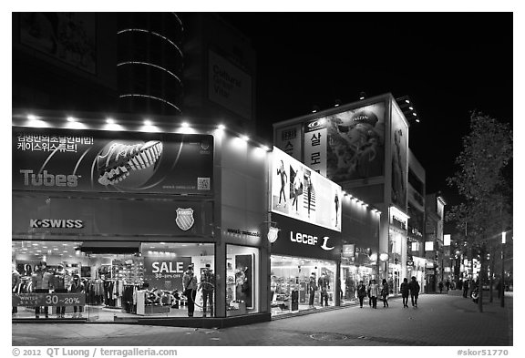 Pedestrian street lined up with outdoor equipment stores. Daegu, South Korea (black and white)