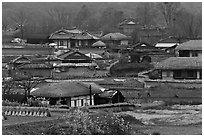 Straw roofed houses and tile roofed houses. Hahoe Folk Village, South Korea (black and white)