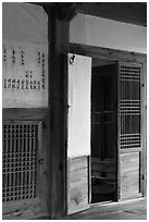 Wooden interior doors in residence. Hahoe Folk Village, South Korea ( black and white)
