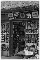 Store selling traditional Hahoe masks. Hahoe Folk Village, South Korea ( black and white)