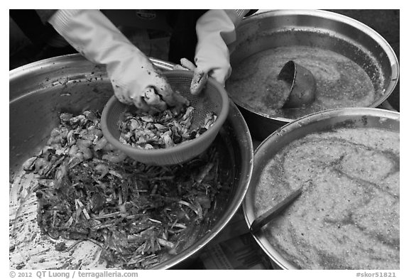 Hands mixing kim chee. Gyeongju, South Korea