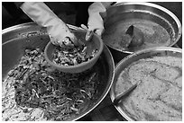 Hands mixing kim chee. Gyeongju, South Korea (black and white)