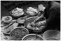 Woman mxing gimchi. Gyeongju, South Korea (black and white)