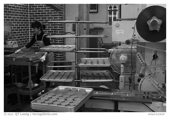 Woman baking Gyeongju barley bread. Gyeongju, South Korea (black and white)