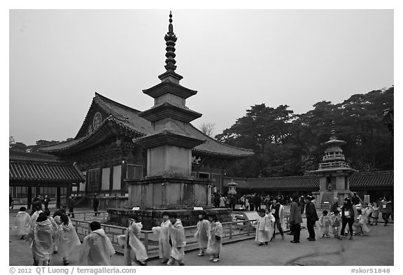 Schoolchildren visiting main courtyard, Bulguk-sa. Gyeongju, South Korea (black and white)