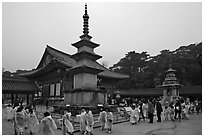 Schoolchildren visiting main courtyard, Bulguk-sa. Gyeongju, South Korea (black and white)