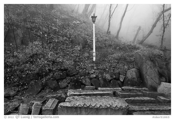 Stones and lantern in fog, Seokguram. Gyeongju, South Korea (black and white)